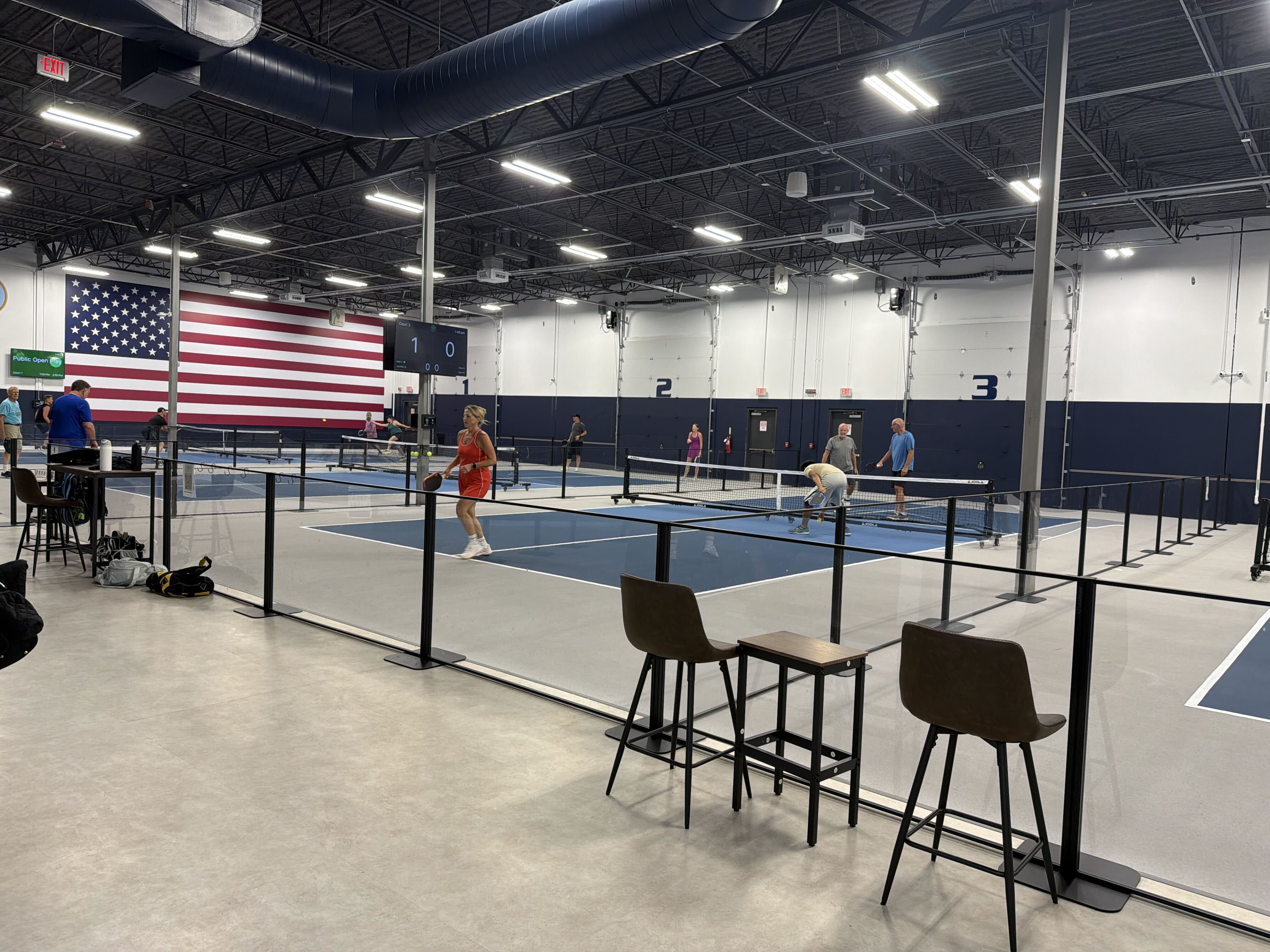 Pickleball courts and seating area at The Pickl Park